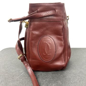 【1円〜】Cartier カルティエ マストライン レザー 巾着型 ショルダーバッグ クロスボディ 斜め掛けかばん レディース ボルドー系